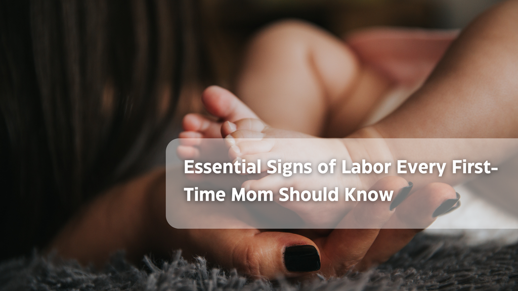 woman's hand and baby's foot with black nail polish and text on labor signs